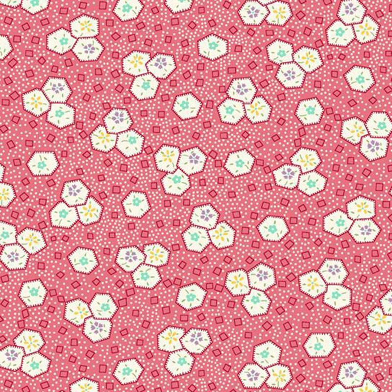 Rouge pink fabric with a pattern of scattered white dots, pink geometrics, and floral-filled hexagons.