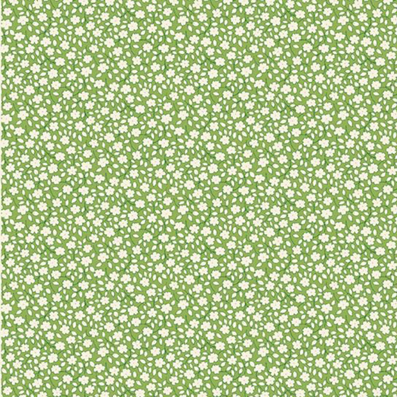 Green fabric with a white leafy and floral calico print.