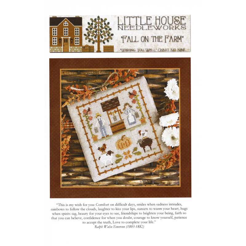 Front of pattern showing the completed cross stitch on a small ornament pillow staged on a table by autumnal sprigs.