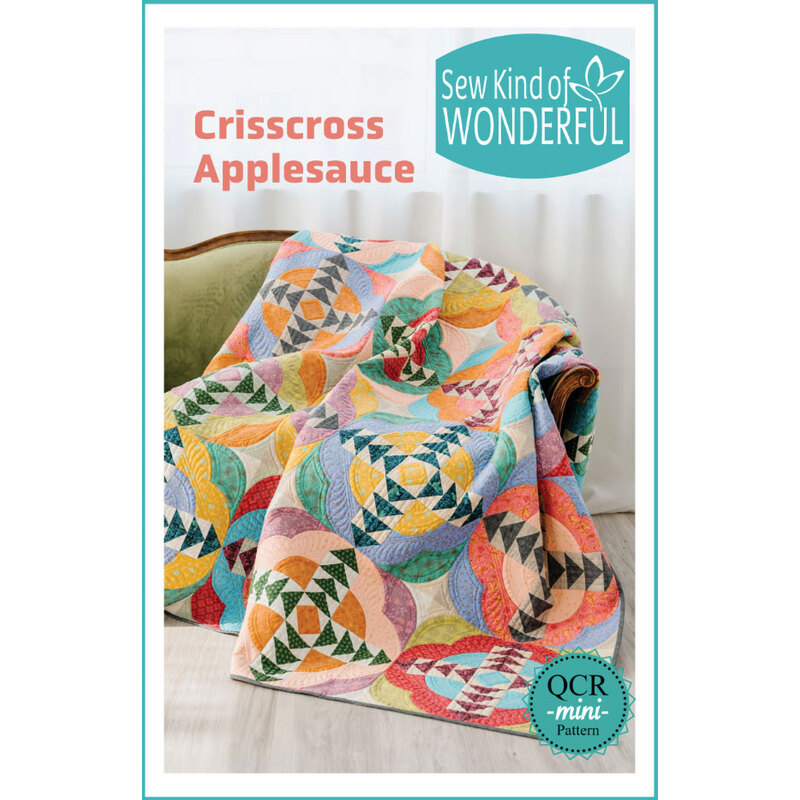 Patter cover of a colorful patchwork quilt pattern titled “Crisscross Applesauce” by Sew Kind of Wonderful.
