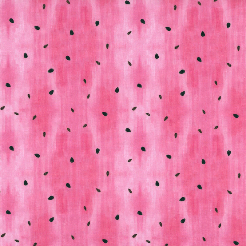 Mottled pink fabric with scattered watermelon seeds. 