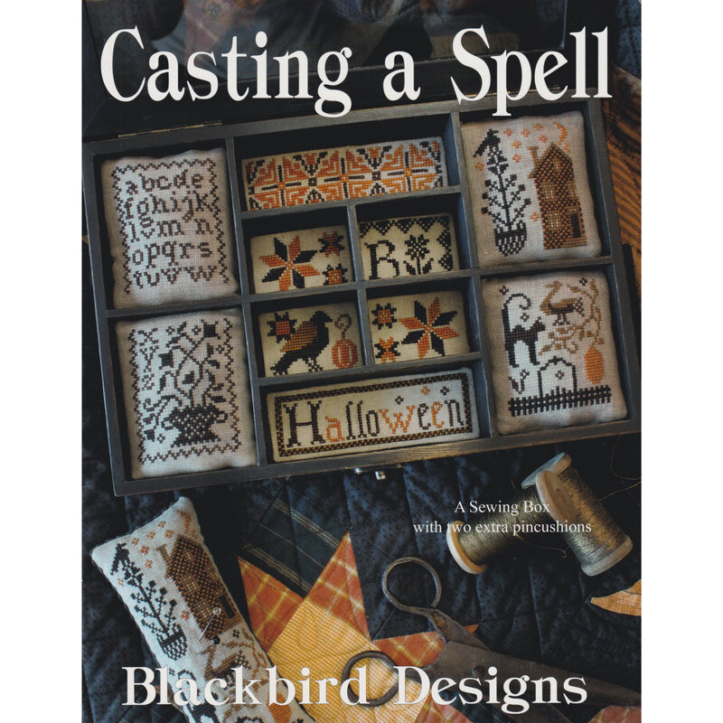 Front cover of the pattern showcasing the finished design staged in a sewing box. 