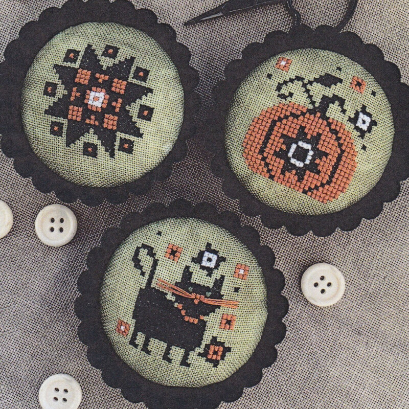 Finished project in tart tins staged alongside white buttons.