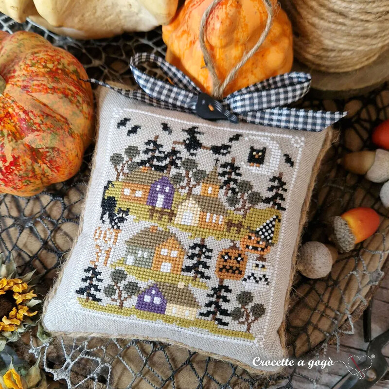 The completed project, a small halloween village, staged with autumnal décor.