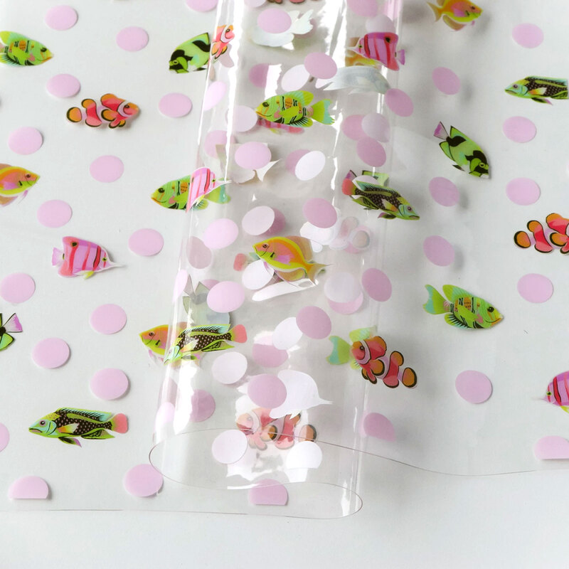 Tula Pink School Crossing TPU vinyl featuring schools of colorful fish in an underwater-inspired design.