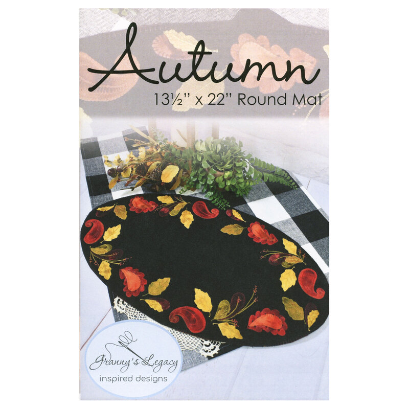 Front cover of the pattern showing the completed wool mat, embroidered with elegant autumnal colors.
