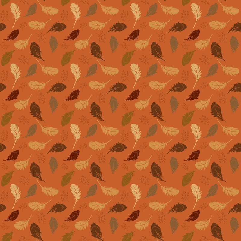 Dark orange fabric with a pattern of tossed fall-colored feathers and leafy sprigs.