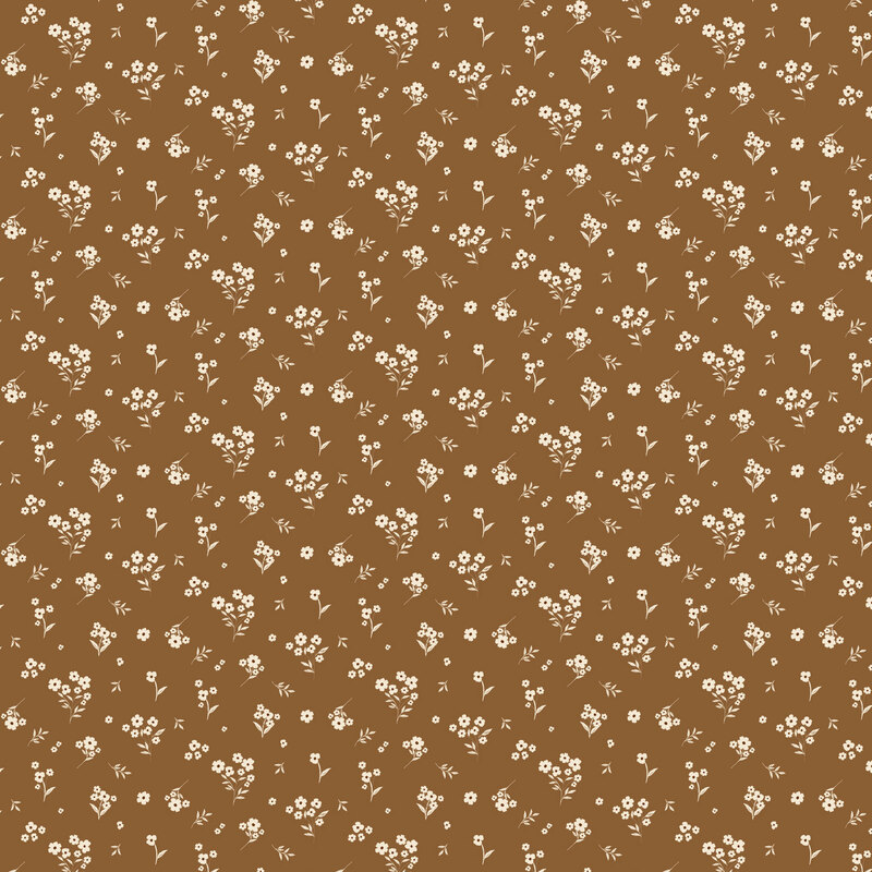 Chocolate brown fabric with a tossed design of white florals and leaves.