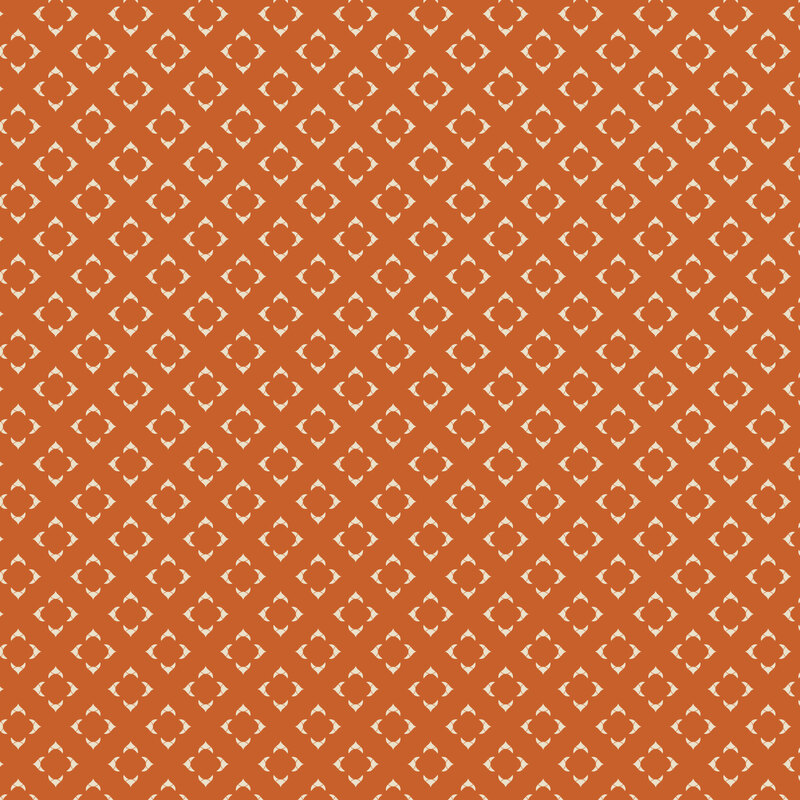 Dark orange fabric with a grid of cream-colored geometrics.