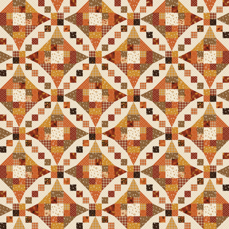 Cream cheater fabric with fall colors and motifs in a Snowball and 5440 Quilt Block design.