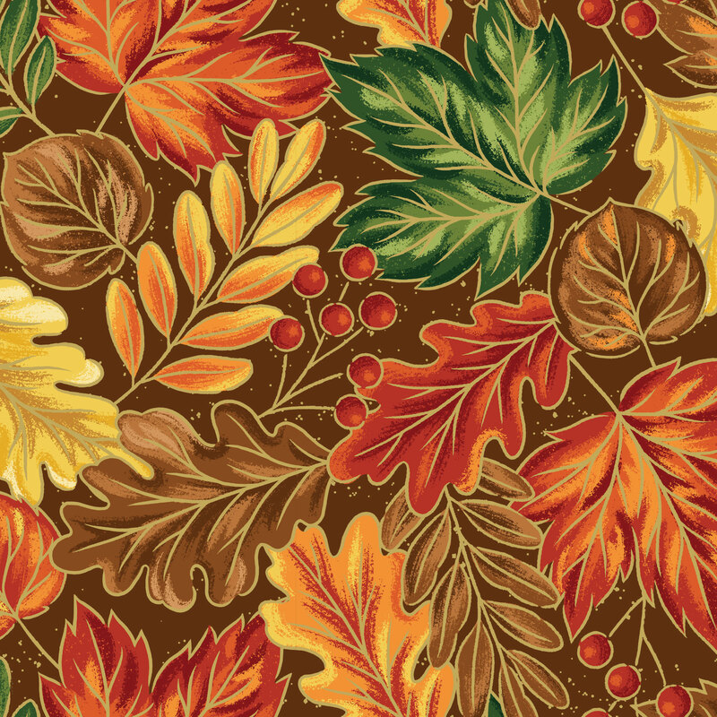 various fall leaves and berry sprigs with metallic gold trim on an chocolate brown background.