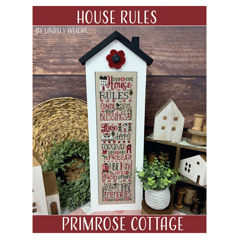 The front of the House Rules cross stitch pattern by Primrose cottage staged with home décor.