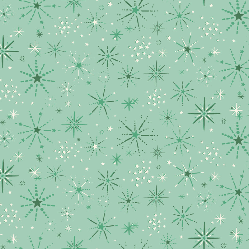 Seafoam fabric with a design of starburst snowflakes and groups of white stars.