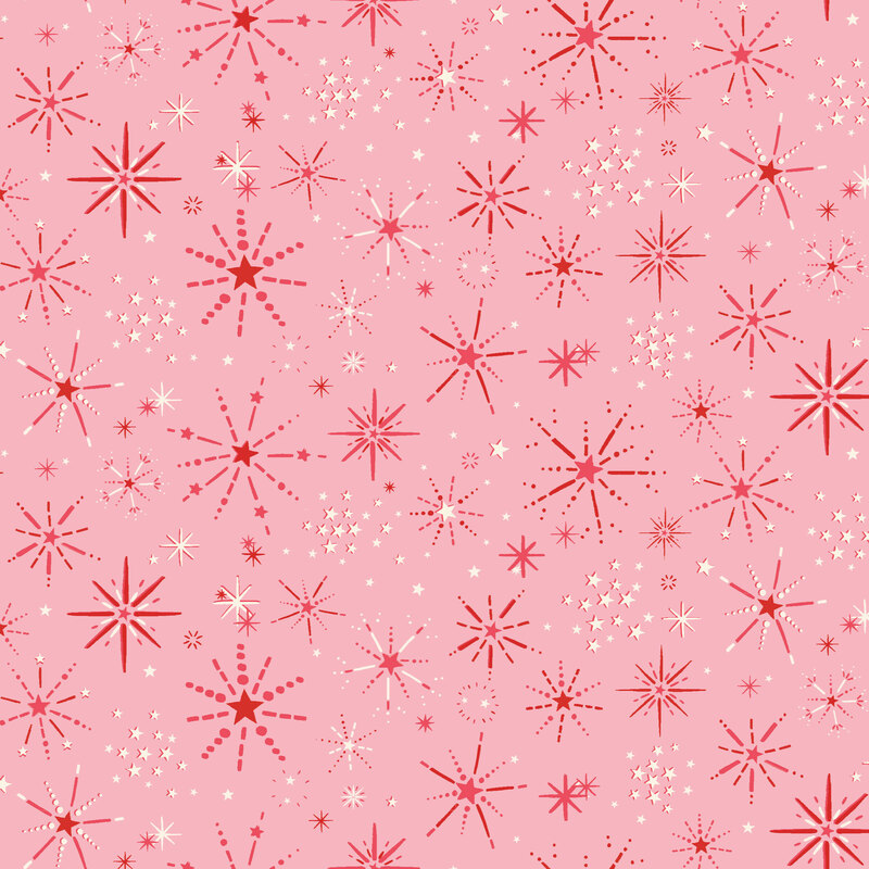 Soft pink fabric with a design of starburst snowflakes and groups of white stars.