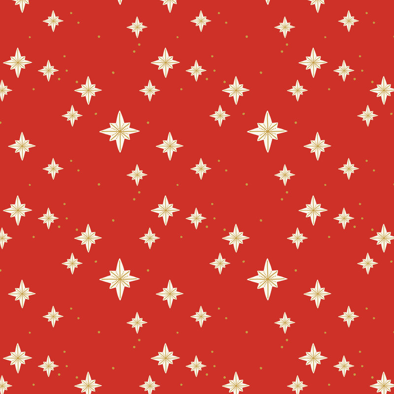 A Christmas red fabric with scattered gold starbursts.