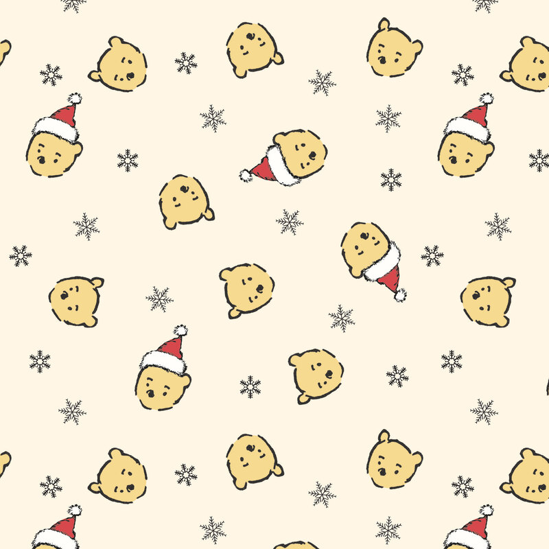 Cream fabric with a tossed design of black snowflakes and Pooh Bear heads wearing Santa hats.