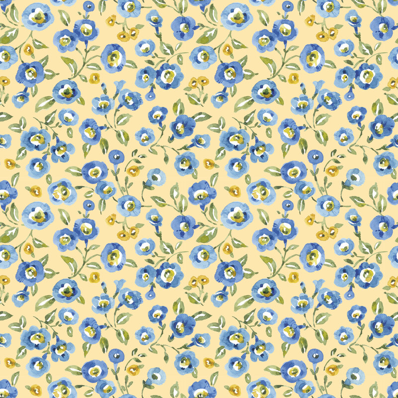 pastel yellow fabric featuring watercolor-style blue blossoms and tiny golden flowers with green leafy sprigs