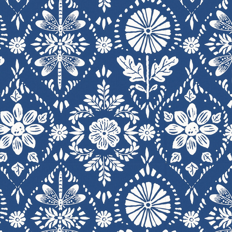 ornamental fabric featuring white stylized sunflowers, leaves, and dragonflies on a navy blue background.