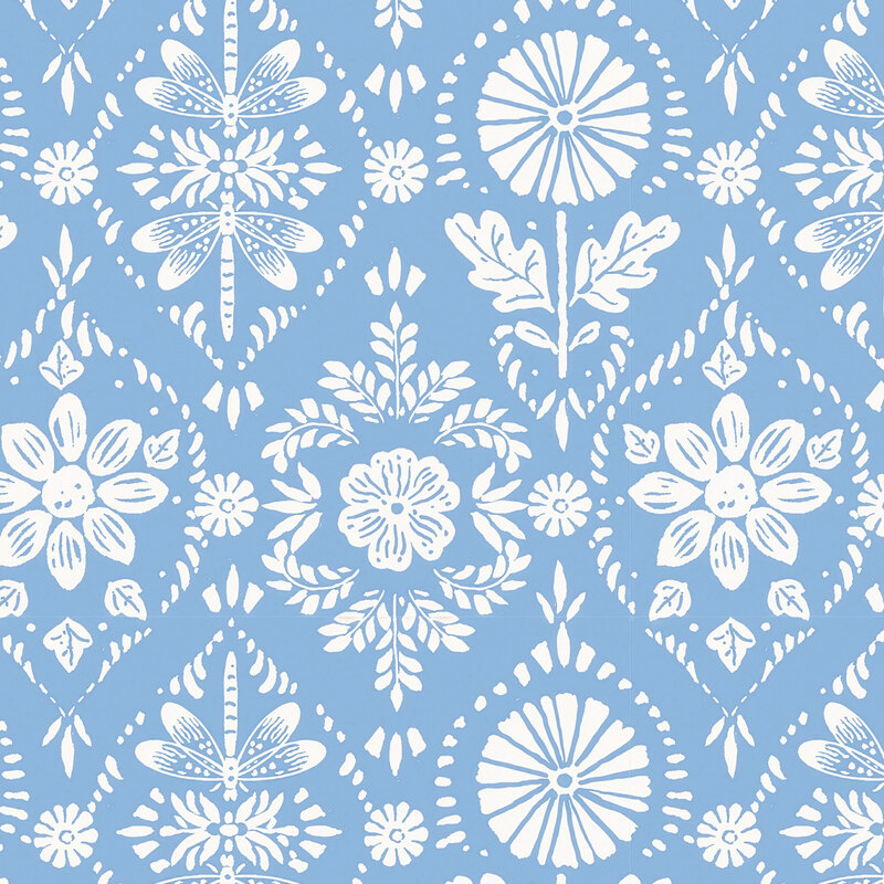 ornamental fabric featuring white stylized sunflowers, leaves, and dragonflies on a light blue background.