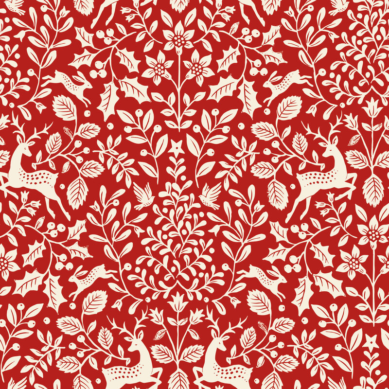 A crimson red fabric with white deer and birds among holly, flowers, and leafy greenery.