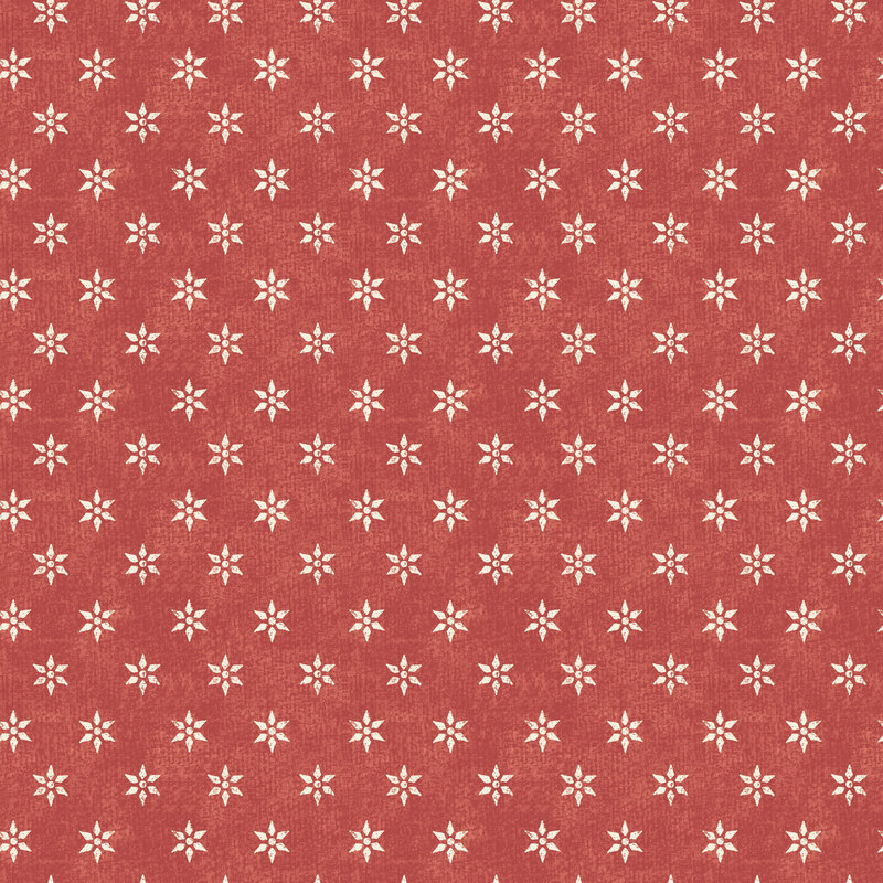 A spice red fabric with cream bowen stars.