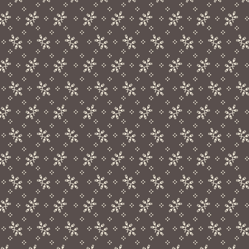 Graphite gray fabric with a scattered pattern of white botanical sprigs and dots.