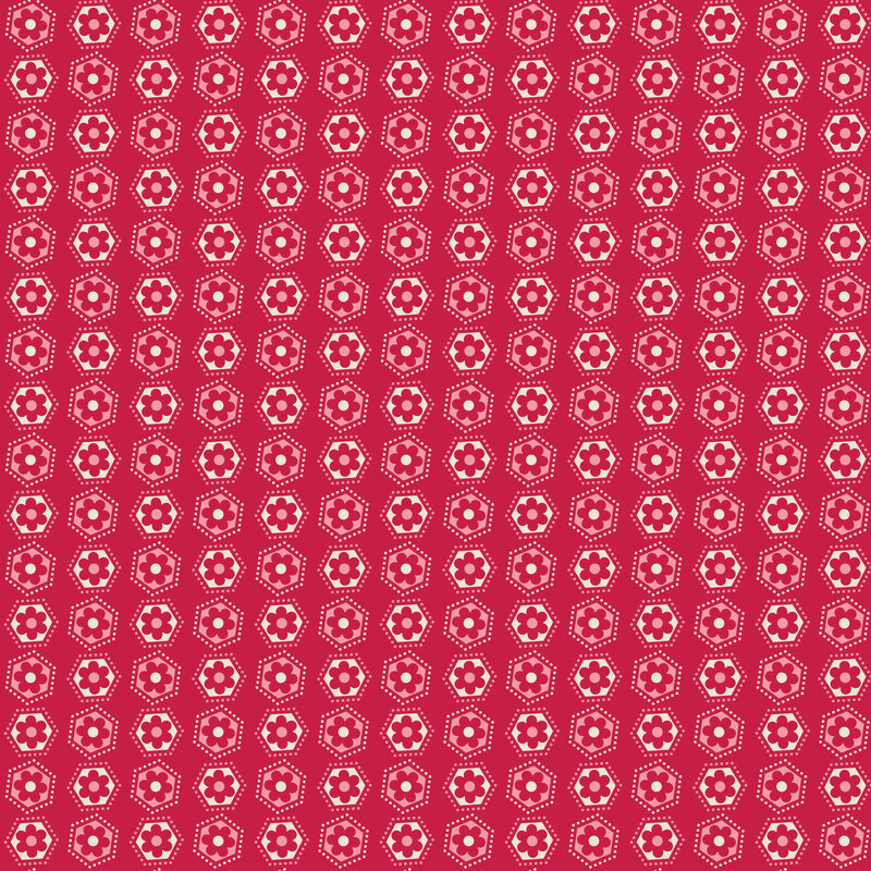 Jazzberry fabric with a grid of hexagons with small florals inside, surrounded by small dots.