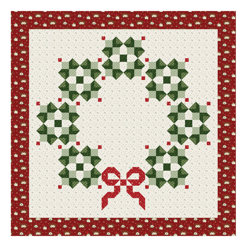 A digital mockup of the Circle of Cheer Quilt kit featuring a patchwork wreath isolated on a white background.