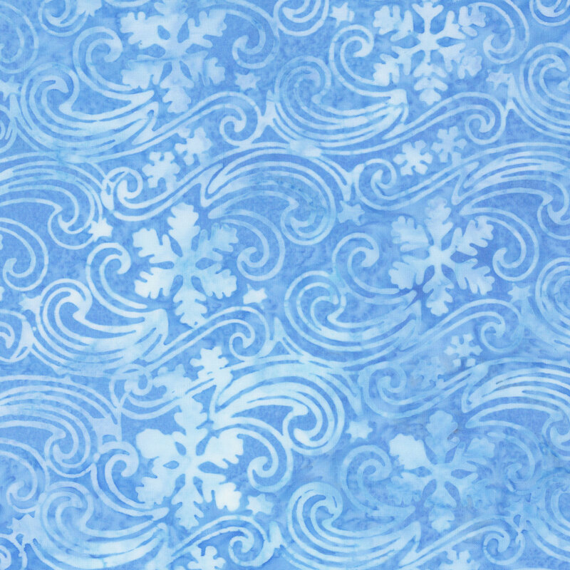 Mottled azure batik fabric with a tonal pattern of snowflakes drifting in the wind.