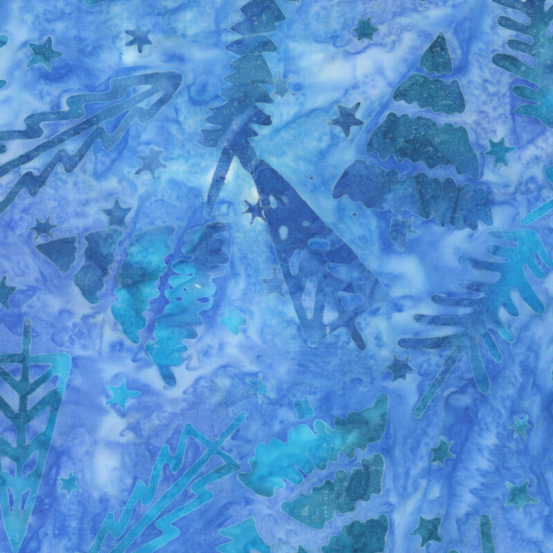 Mottled blue batik with a tossed pattern of Christmas trees and stars.