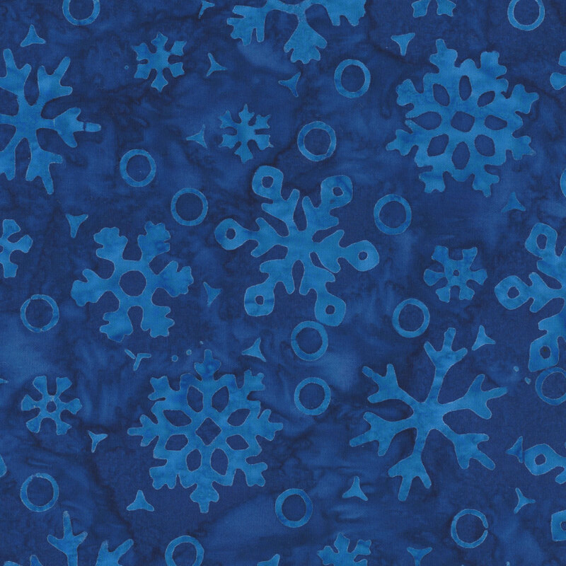 Mottled dark blue fabric with a tonal pattern of snowflakes and circles.