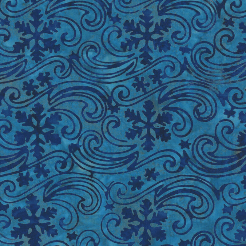 Mottled dark teal batik fabric with a pattern of snowflakes drifting in the wind.