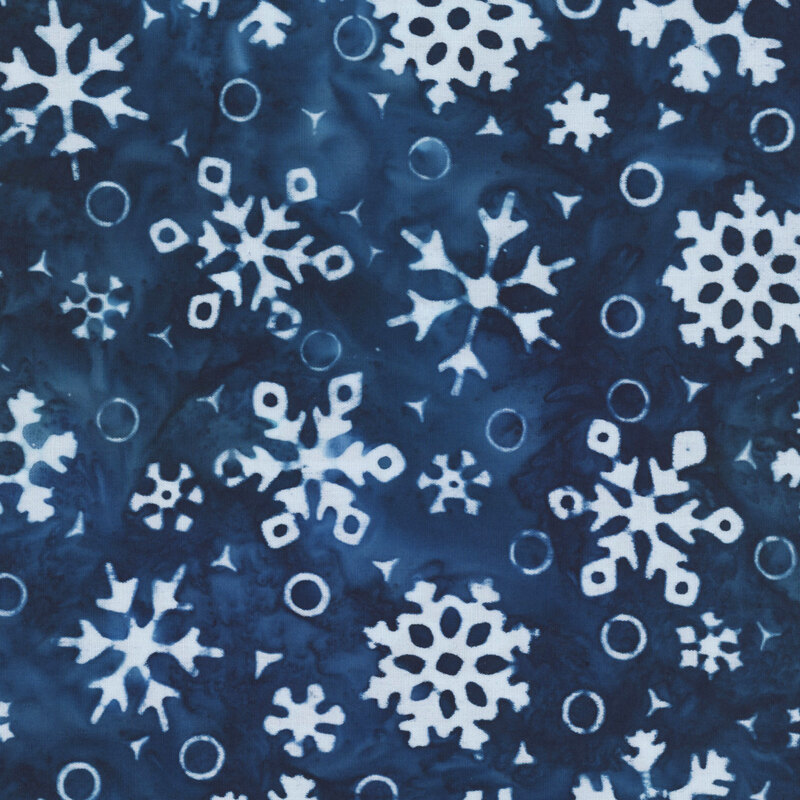 Mottled dark blue fabric with a white pattern of snowflakes and circles.