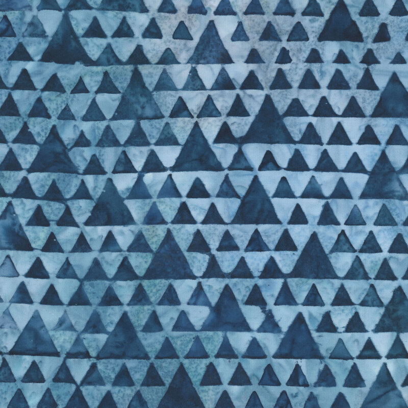 Mottled blue batik with a geometric triangle lattice pattern.