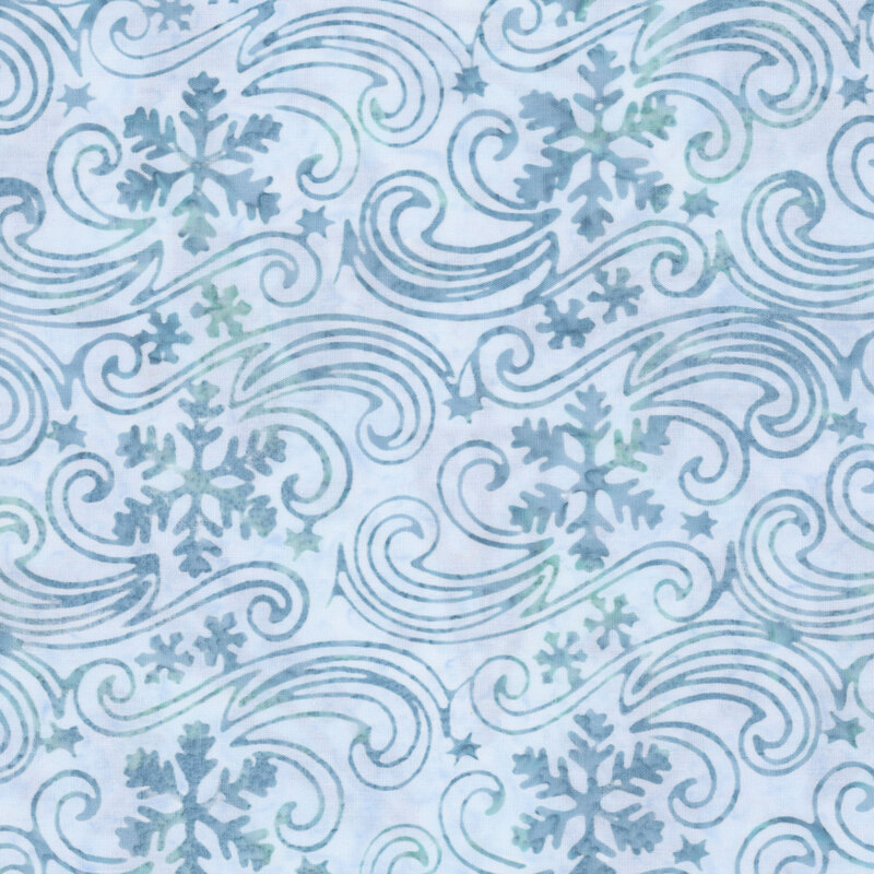 Mottled gray blue batik fabric with a pattern of snowflakes drifting in the wind.