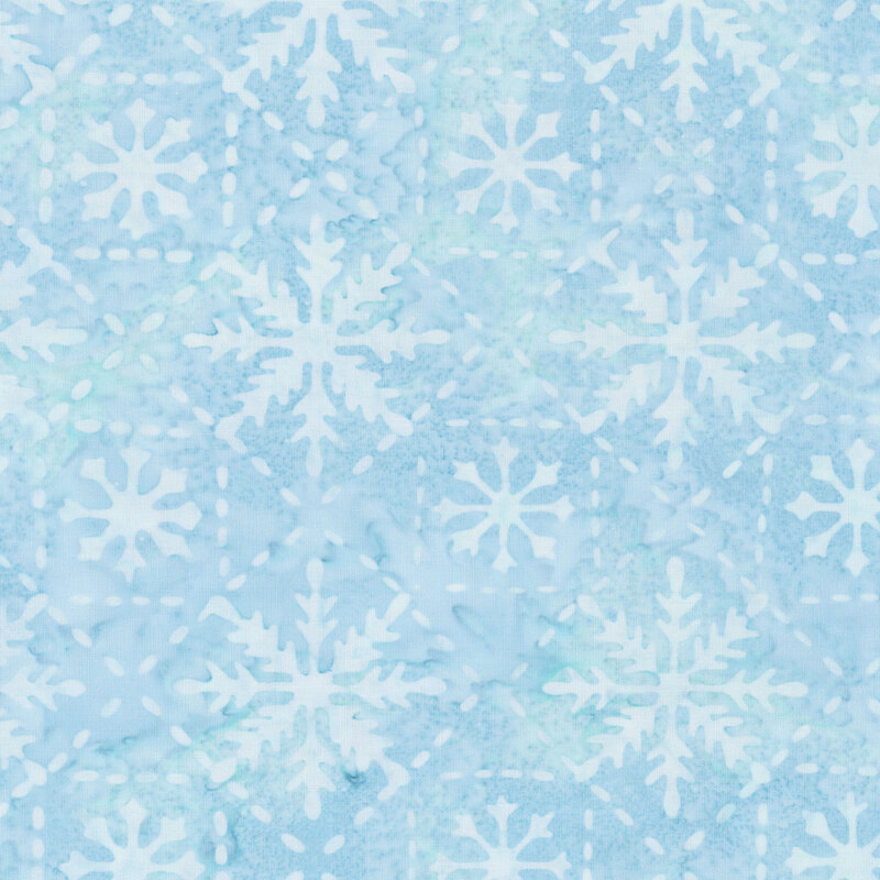 Mottled light blue batik fabric with a tonal lattice pattern accented with snowflakes.