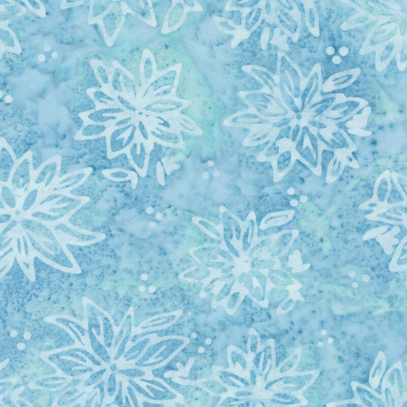 Mottled blue batik fabric with a tossed pattern of tonal florals.