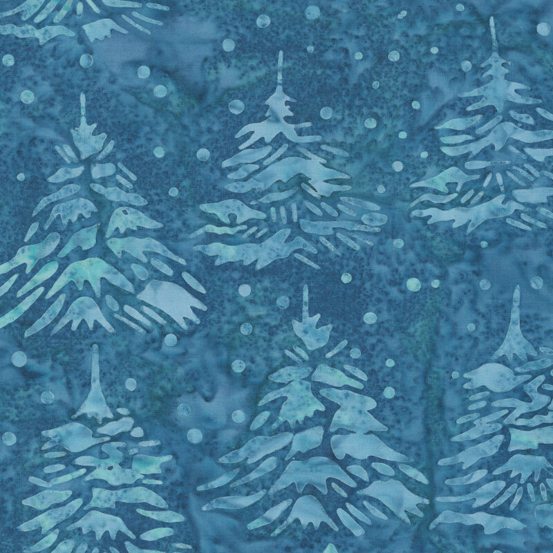Mottled blue batik fabric with a pattern of tonal trees and scattered dots.