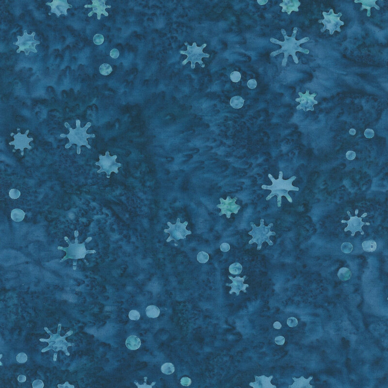 Mottled blue fabric with a tossed pattern of small dots and irregularly shaped snowflakes.