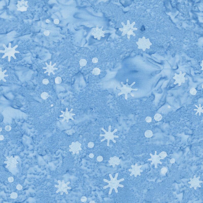 Mottled blue fabric with a tossed pattern of small dots and irregularly shaped snowflakes.