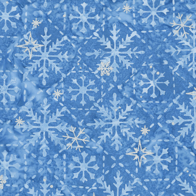 Mottled blue batik with a lattice pattern with centered snowflakes, accented by scattered silver metallic winter motifs.