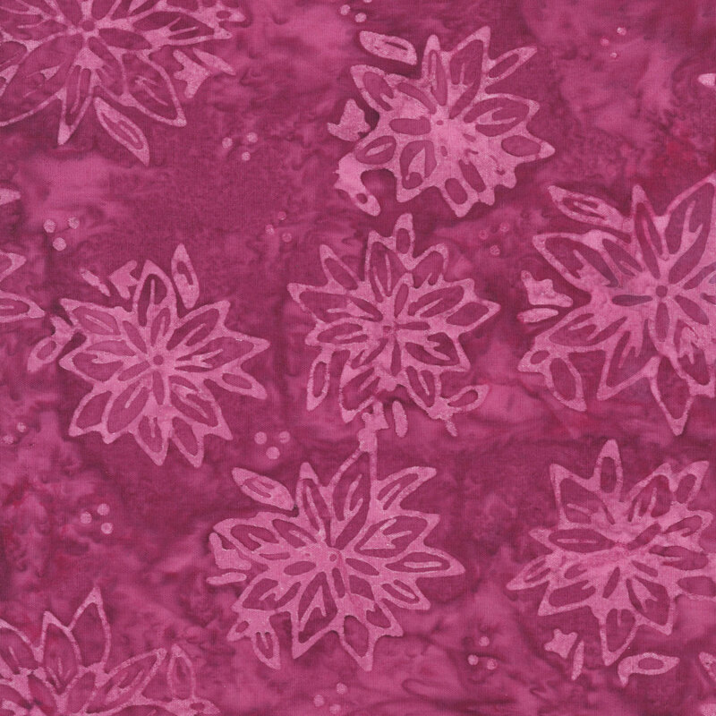 Mottled orchid batik fabric with a tossed pattern of tonal florals. 