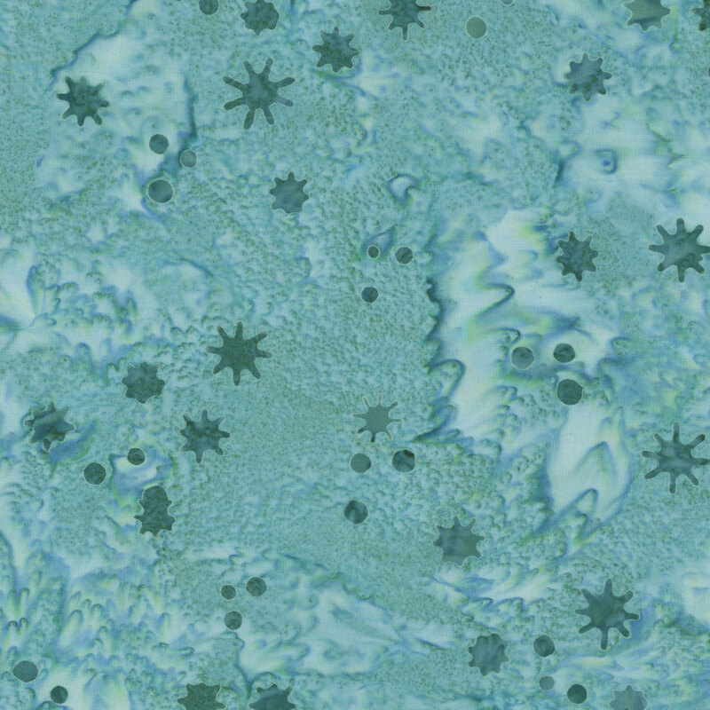Mottled teal fabric with a tossed pattern of small dots and irregularly shaped snowflakes.