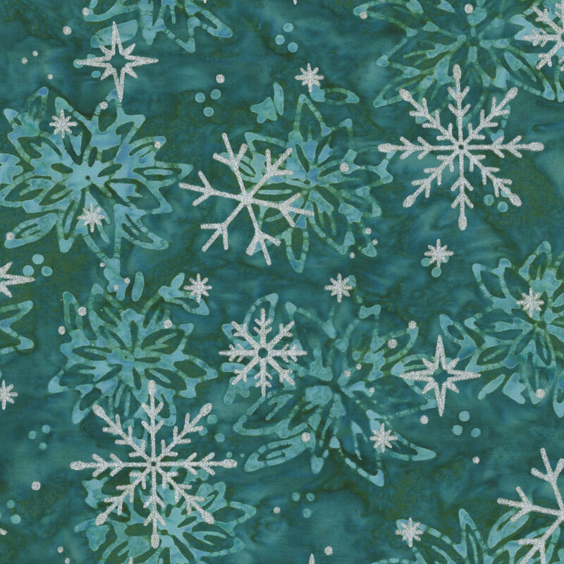 Mottled dark teal batik with a tossed floral pattern accented with scattered silver metallic winter motifs.