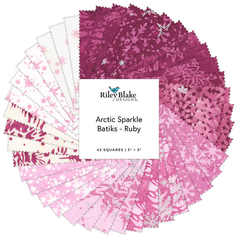 Package of pink and white fabric squares labeled “Arctic Sparkle Batiks - Ruby”