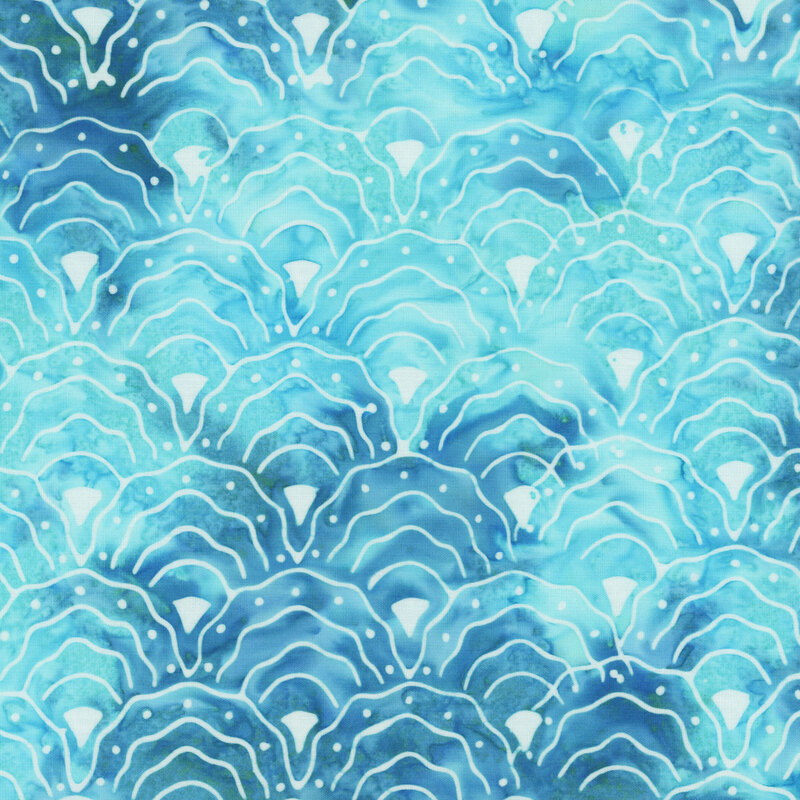 Bright aqua and dark teal mottled fabric with a repeating pattern of scalloped fan motifs in white