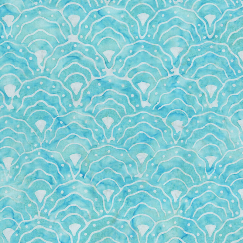 turquoise mottled fabric with a repeating pattern of scalloped fan motifs in white