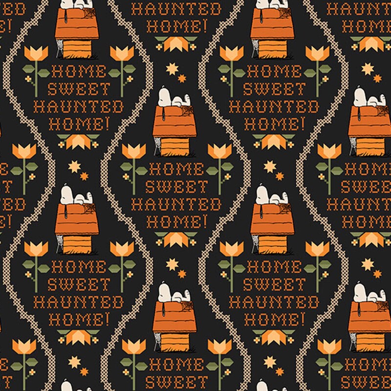 A charcoal Peanuts fabric with Snoopy on his doghouse, "Home Sweet Haunted Home!" sayings, flowers, stars, and stitched details.