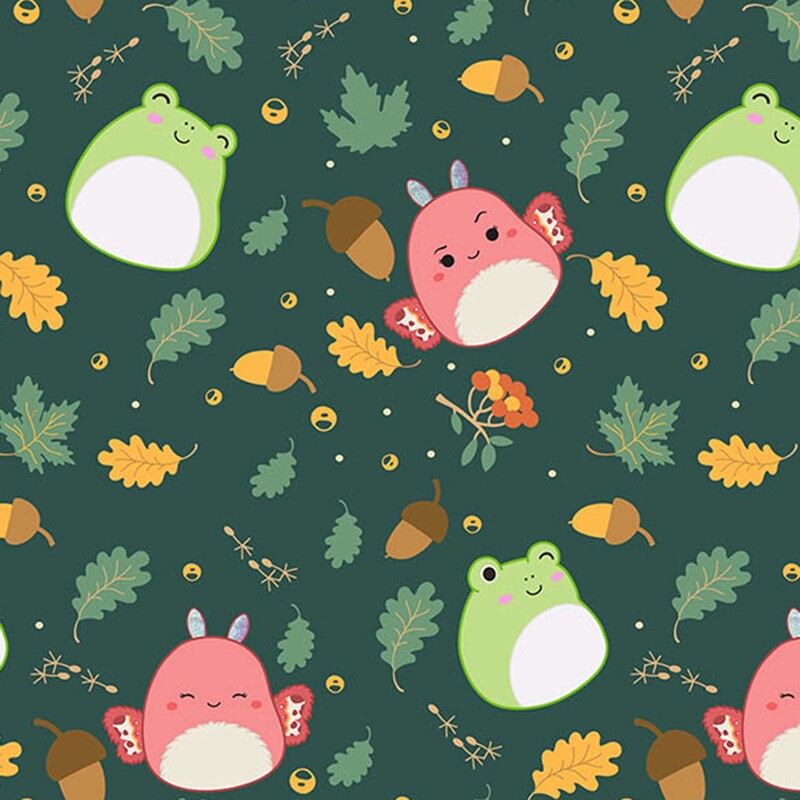 Pine green fabric with a tossed pattern of leaves, acorns, sprigs, and frog and butterfly Squishmallows.