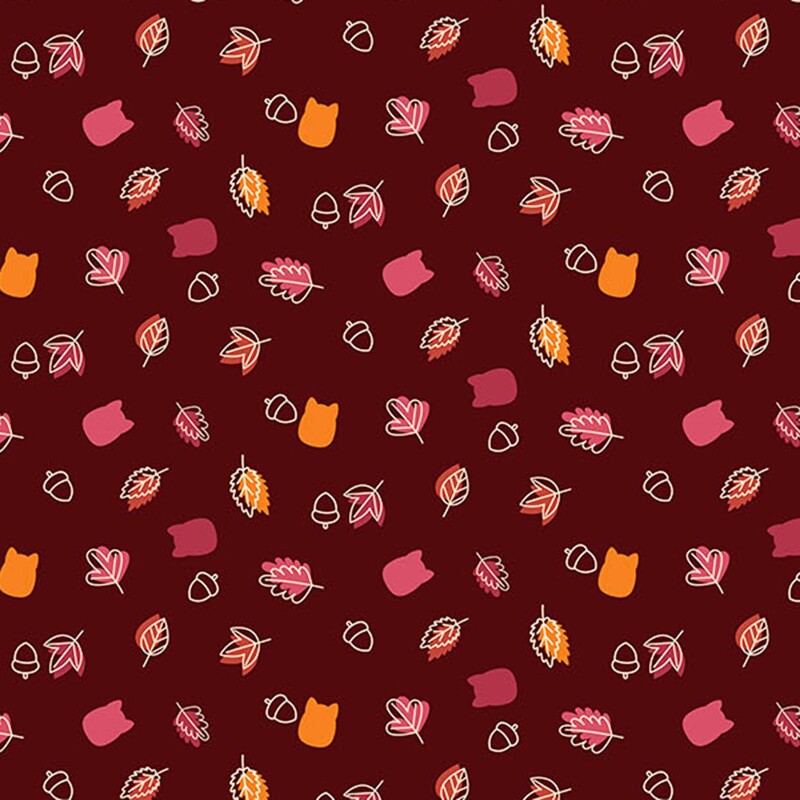 Merlot fabric with a tossed design of fall leaves, acorns, and cat Squishmallow silhouettes in quaint, autumnal colors.